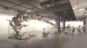 Cai Guo Qiang, Head on, 2006, 99 life-sized replicas of wolves and glass wall. Wolves: gauze, resin, and painted hide, Dimensions variable. Deutsche Bank Collection, commissioned by Deutsche Bank AG. Installation view at Taipei Fine Arts Museum, 2009   